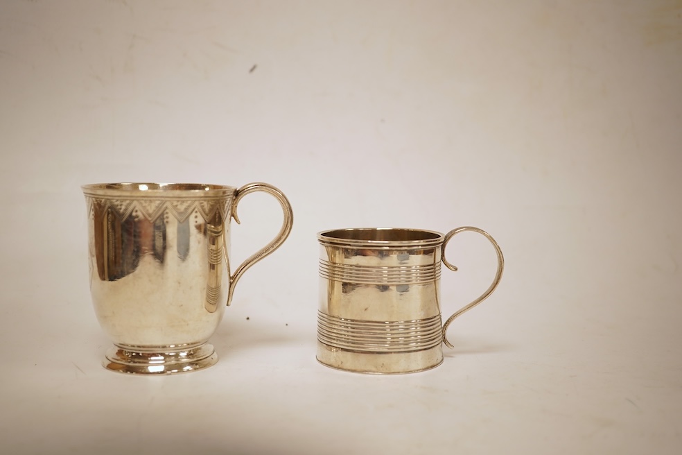 A small late George III reeded silver christening mug, London, 1818, height 51mm, together with a later Victorian silver christening mug, Arthur Sibley, London, 1764.